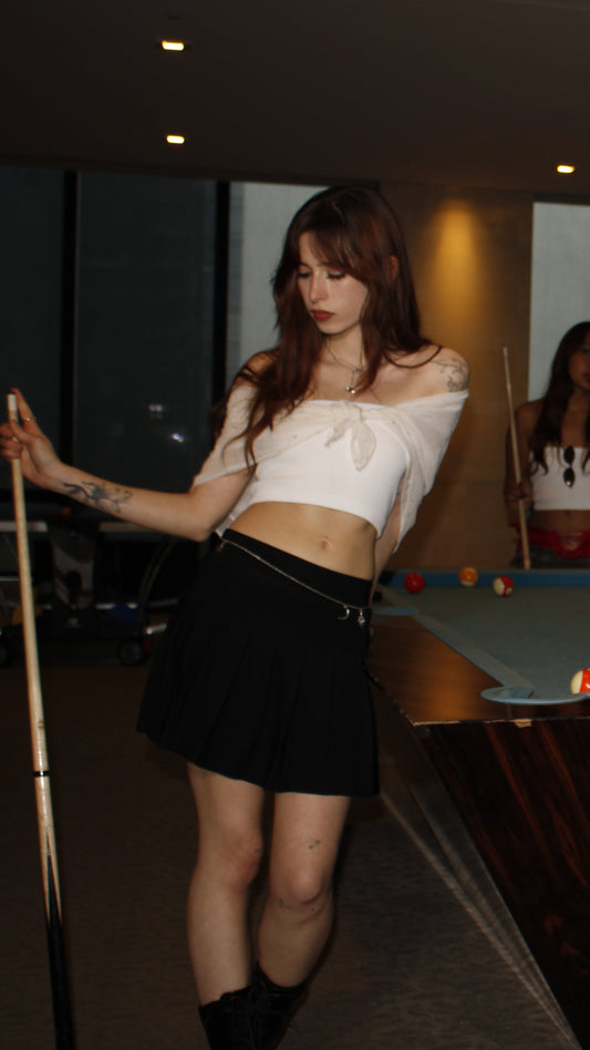 People playing pool in a dimly lit room