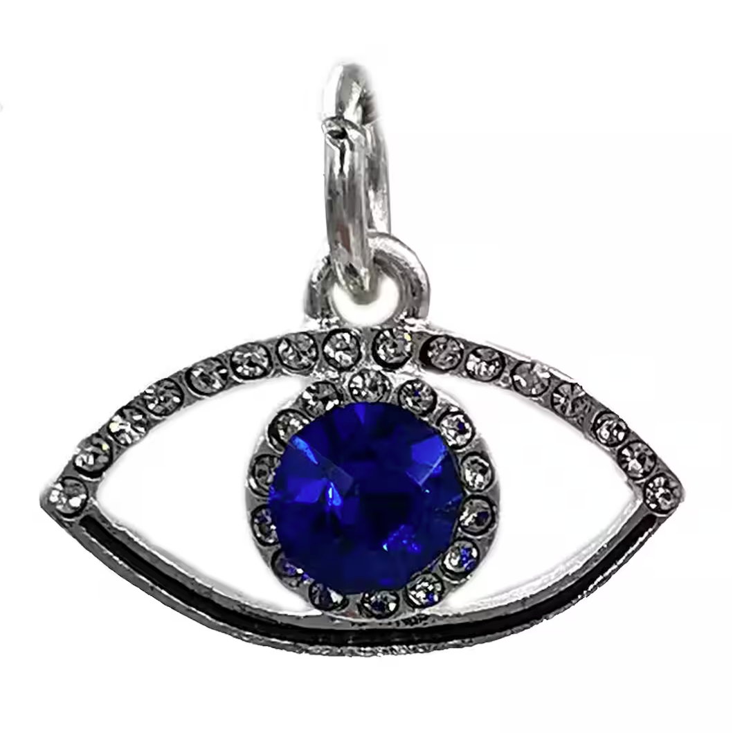 Eyes-shaped pendant with a blue gemstone on a white background